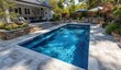 © farisky - Backyard swimming pool with patio area