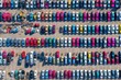 © MOON - Drone top-down photography of large parking area with hundreds of cars, colorful vehicles arranged in order, geometric transportation and automobile industry background
