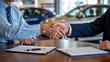 © PixelVerseStudio - Businessman and customer shaking hands over car purchase agreement at dealership