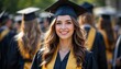 © Aliona - Graduate in cap and gown smiling among peers after graduation ceremony.