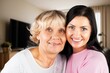 © BillionPhotos.com - Happy woman hug senior patient at retirement home.