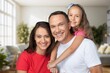 © BillionPhotos.com - Cheerful smiling family sitting in the living room