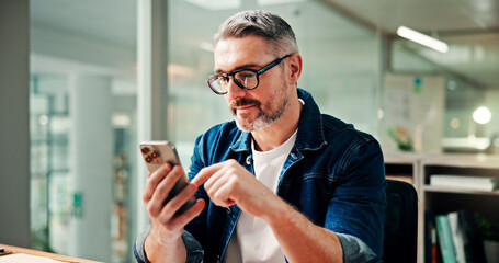 Phone, typing and business man in office for social media break, message and email for networking. Creative, professional and mature worker on smartphone for internet, website and online research