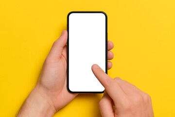 person holding smartphone with blank white screen in hand against yellow background showing mockup a