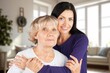 © BillionPhotos.com - Happy woman hug senior patient at retirement home.