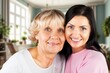 © BillionPhotos.com - Happy woman hug senior patient at retirement home.