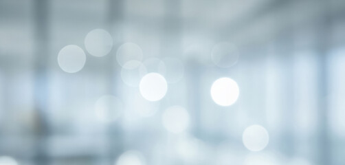 Abstract blurred background with light blue and white tones bokeh effect, creating a dreamy serene atmosphere that feels soft, modern, and visually calming.