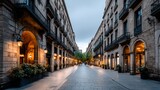 European city street at dawn. Buildings line a paved thoroughfare, illuminated by golden light