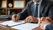 © Kateryna - Notary public office during property transaction closing official seal and stamp prominently displayed multiple signature pages spread across desk clients reviewing final