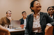 © Johnér - Male and female business coworkers listening to ideas shared in meeting at office board room
