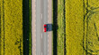 © Johnér - Aerial view of car moving on country road amidst field