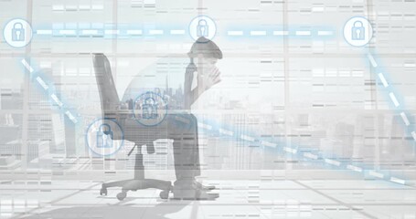 Wall Mural - animation of connections with padlocks over tired caucasian businessman in office