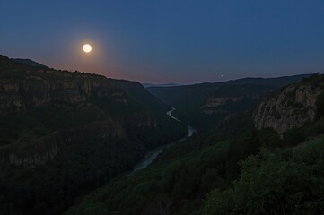 Wall Mural - Unique valley illuminated by moonlight at dawn