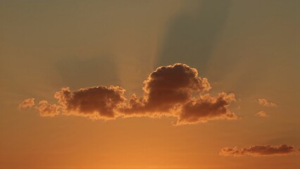Wall Mural - clouds and sunshine blend in a bright sunset sky, perfect for creative graphics.
