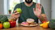 © Artistic - Man chooses healthy apple over sweet donuts, embracing a healthy lifestyle
