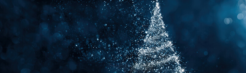 Sparkling abstract Christmas tree made of glittering particles against a dark blue bokeh background; festive digital art.