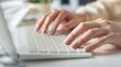 © CuteBee - Typing on laptop keyboard close up hands working from home office business technology computer device work