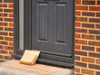 © Mike Hayward - Delivered cardboard packages being left outside at front door