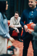 © Maskot - Contemplative male entrepreneur sitting on sofa during networking event in convention center