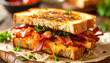 © hardvicore - Toasted sandwich with crispy bacon, melted sauce and parsley. Tasty food Delicious snack.