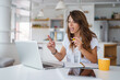 © Dorde - Energetic Professional Woman Making Animated Hand Gestures While Working From Home During Video Conference Call