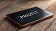 © FocusFusion - Tablet Displaying Profit Metrics on Wooden Table in Office Setting
