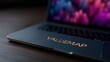 © FocusFusion - Modern Laptop Displaying Valuemap Logo on Sleek Workspace Environment