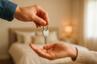 © Jiajia - Handing over house key symbolizing new home, real estate, and homeownership