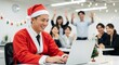 © Stingray_Japan - クリスマスにオフィスでサンタクロースのコスプレをしている日本人男性社員