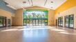 © Naeem - Bright and spacious community center hall with large windows and natural light flooding the polished floor space