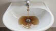 © innovative - dirty brown water pouring into a sink | environmental issues, domestic, water management, sanitation, hygiene theme