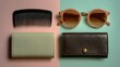 © Sufyan - Flatlay of comb, sunglasses, and wallets on pastel background