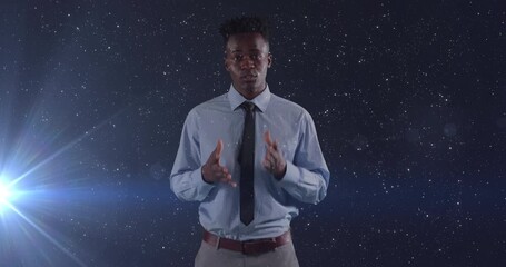 Wall Mural - animation of african american businessman talking over space and light spots