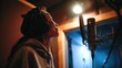 © CStock - A musician records vocals in a professional studio, showcasing passion and creativity in music production.