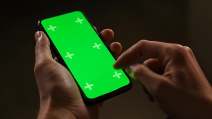 Hands using smartphone green screen