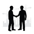 © Agus - Silhouette of Two Construction Workers Shaking Hands in Agreement