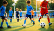 © wetzkaz - selective focus blur of group of young boys in colorful uniforms chasing soccer balls on sunny field