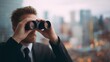 © backup_studio - Young man in suit looking through binoculars. Businessman searching for future business opportunities. Prospecting new horizon for leadership.
