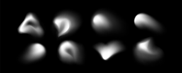 Blur shape blob collection with soft white gradient forms on black background for abstract design and overlay effects. Smooth organic modern elements with diffused blurry edges and glowing spots