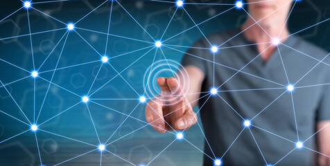 Wall Mural - Man touching a virtual network