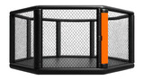 Octagonal MMA cage with chain-link fencing and padded posts for combat sports