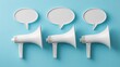 © Ariansyah - Three white megaphones and speech bubbles on a light teal background