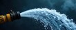 © Patama - Powerful jet of water from a fire hose, spraying a high arc against a dark smoky background Ideal for illustrating firefighting, emergency response, or water power , pressure, splash