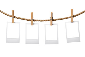 Four Instant Photo Frames Hanging on Rope isolated on transparent background, Clipart png