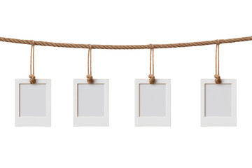 Four Instant Photo Frames Hanging on Rope isolated on transparent background, Clipart png