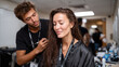 © Milos - A makeup artist carefully applies makeup to a model's face, capturing the intimacy and focus of the beauty process before a stunning reveal during a photoshoot.