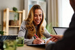 © djile - Happy woman signing contract after successful job interview or loan approval