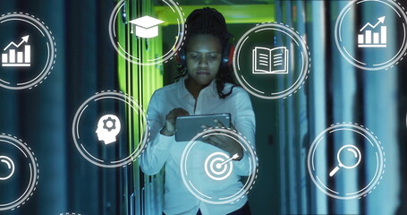 Wall Mural - tech professional woman tapping tablet in server rack corridor, showing floating analytics icons