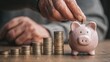 © Dao - Saving money investment for future. old man hand putting money coins in a piggy bank.investment, money, annuity insurance, saving for retirement and pension fund concept.Individual retirement account.