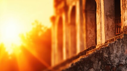 Wall Mural - Golden sunset illuminating ancient architecture, creating a warm ambiance in a serene outdoor setting